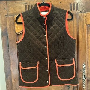 Elizabeth McKay quilted corduroy vest brown with a red orange piping.